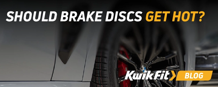 car tyre with the brake rotor on the inside and red brake calipers